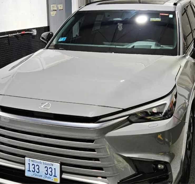 Close-up of gray Lexus RX in garage with shiny exterior