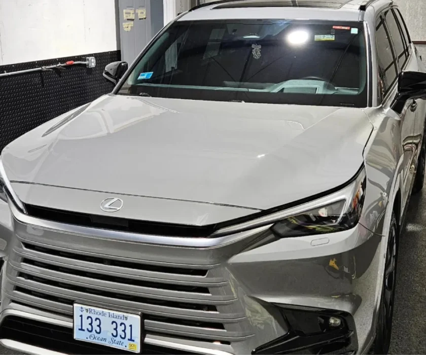 Close-up of gray Lexus RX in garage with shiny exterior