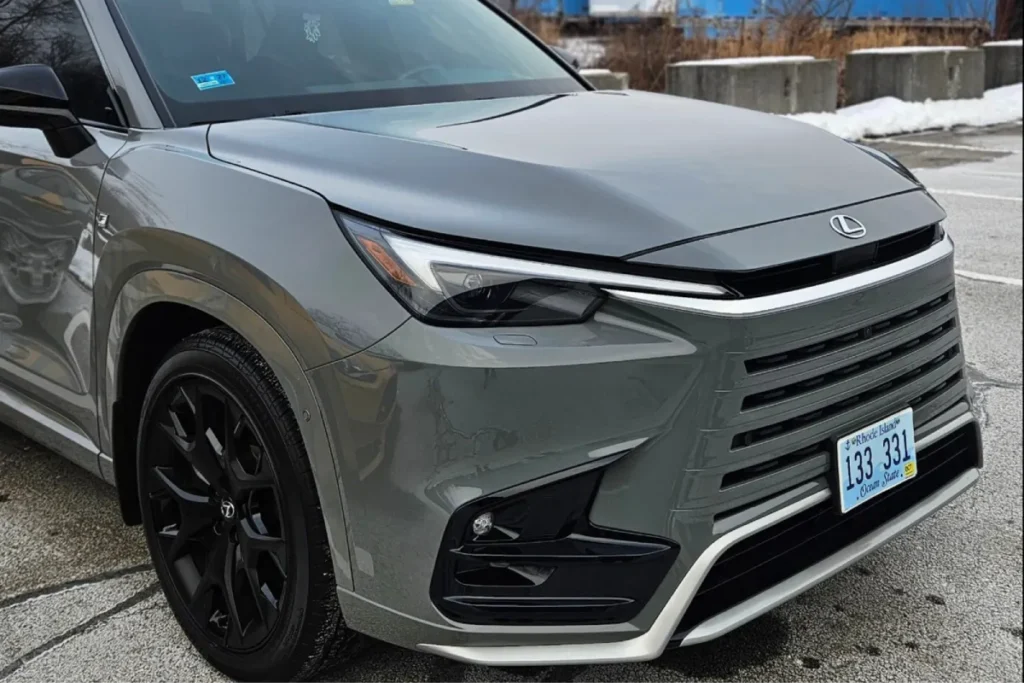 Gray Lexus RX parked outside with a clean polished front