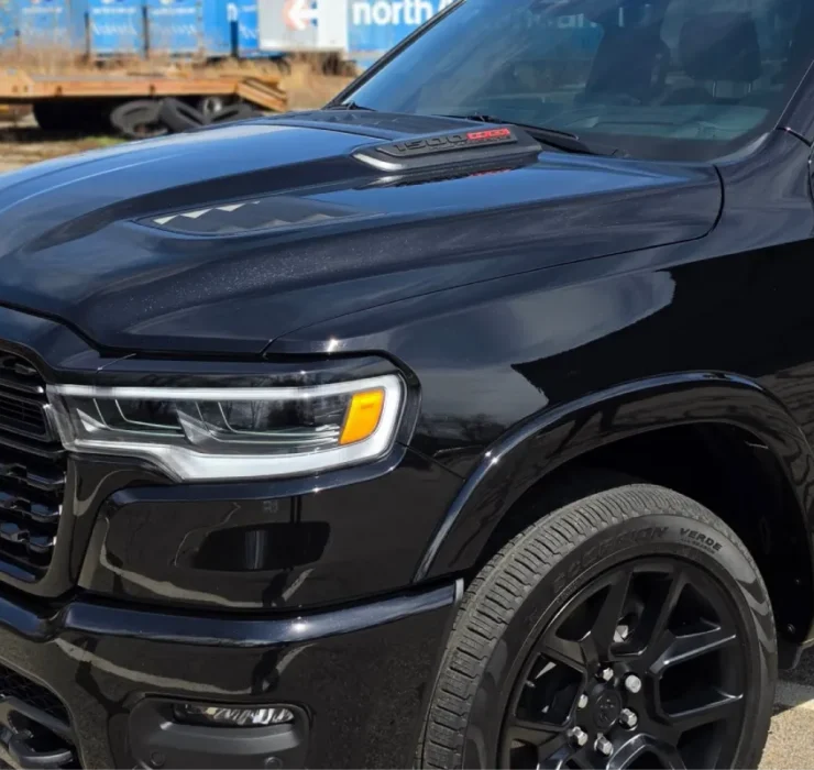 Black car with glossy ceramic coating finish.
