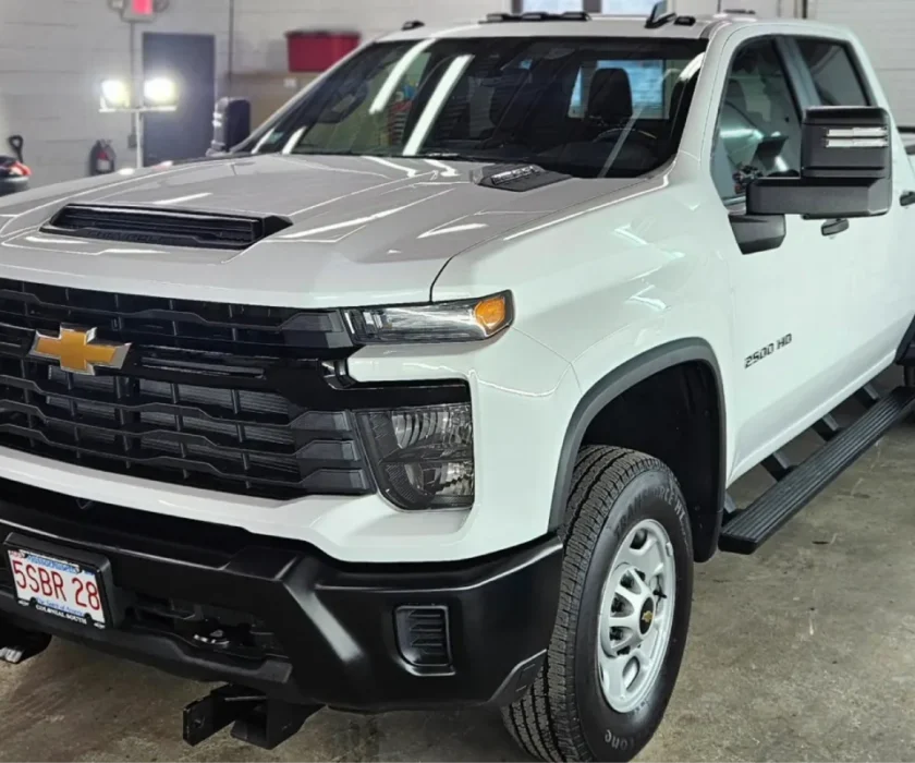White Chevrolet Silverado 2500 HD truck in detailing shop